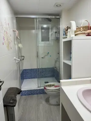 a bathroom with a shower and a toilet and a sink at Habitación Amaya 2 in Las Corts