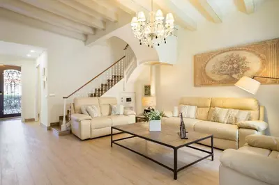 a living room with two couches and a table at Sitges Spaces Beach House-4 bedrooms, 3 Bathrooms, Large Terrace, Jacuzzi, Center-Beach in Sitges