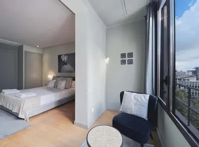 a bedroom with a bed and a large window at Stay U-nique Apartments Rambla Catalunya II in Barcelona