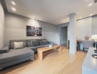a living room with a couch and a table at Stay U-nique Apartments Rambla Catalunya II in Barcelona
