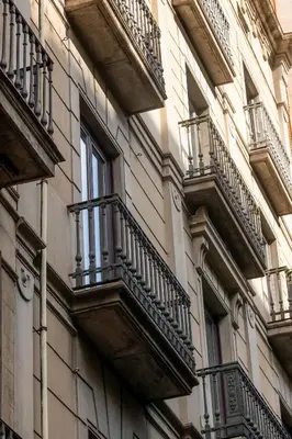 a building with balconies on the side of it at Colectia Stays Pau Claris in Barcelona