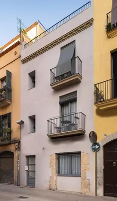a building with balconies on the side of it at PassiveRooms in Vilanova i la Geltrú