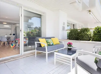 a living room with a couch and a table at SITGES POOL & SEA TERRACE Luxury, comfort, unbeatable location in Sitges