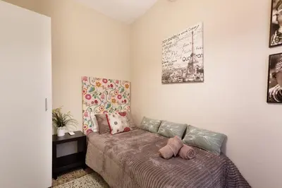 a bedroom with a bed with two pillows at Mercat Sant Antoni 1 in Barcelona