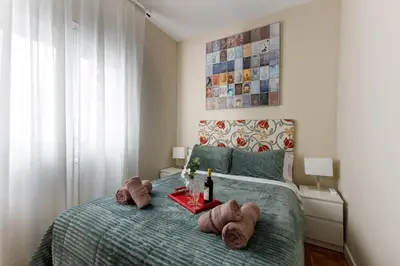 a bedroom with a bed with towels on it at Mercat Sant Antoni 4 in Barcelona