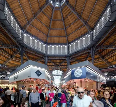 a large crowd of people walking around a market at Mercat Sant Antoni 4 in Barcelona