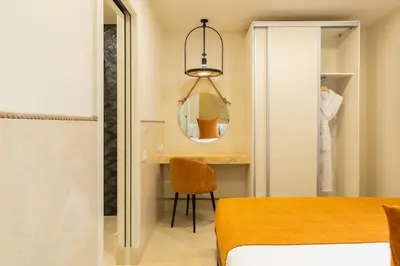 a bedroom with a bed and a mirror at Cosmo Apartments Rambla Catalunya in Barcelona