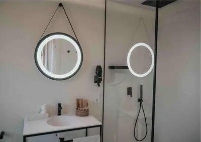 a bathroom with a sink and a mirror on the wall at Les Quingles in Calders