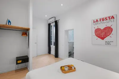 a white room with a table with a toy on it at AB Gran de Gràcia in Barcelona