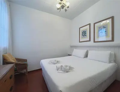 a bedroom with a white bed with towels on it at Stay U-nique Apartments Rogent in Barcelona