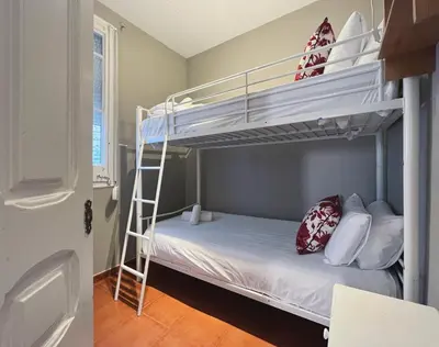 a bedroom with two bunk beds and a ladder at Stay U-nique Apartments Rogent in Barcelona