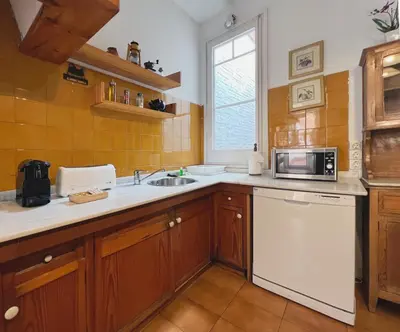 a kitchen with a sink and a microwave at Stay U-nique Apartments Rogent in Barcelona