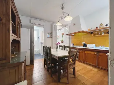 a kitchen with a table and chairs in a room at Stay U-nique Apartments Rogent in Barcelona
