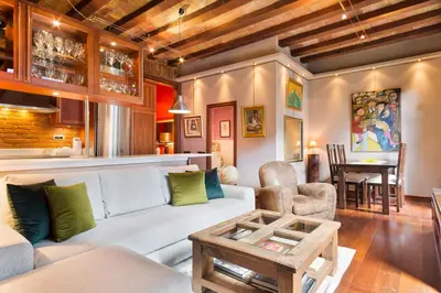 a living room with a couch and a table at Stay U-nique Apartments Urquinaona in Barcelona