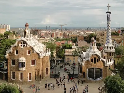 a group of people walking in front of a building at Atic Gaudi-Gracia in Barcelona
