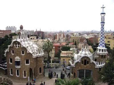 a group of people walking around a building at Atic Gaudi-Gracia in Barcelona