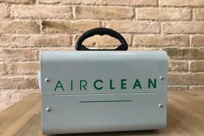 a metal box with an american sign in front of a brick wall at Barcelona Industrial Style Apartment in Hospitalet de Llobregat