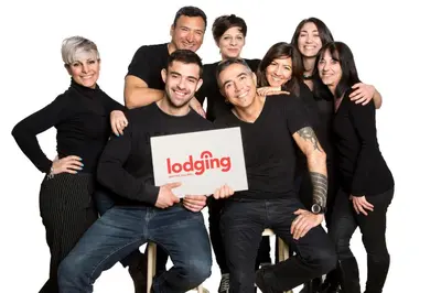 a group of people holding a loading sign at Kronos on the beach Suite 2 in Barcelona