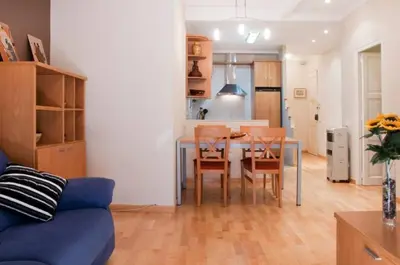 a kitchen and dining room with a table and chairs at Bbarcelonapartment Acogedor, tranquilo con Balcón in Barcelona