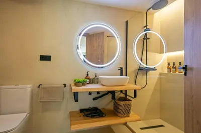 a bathroom with a sink and a mirror at Olivia Barcelona in Barcelona