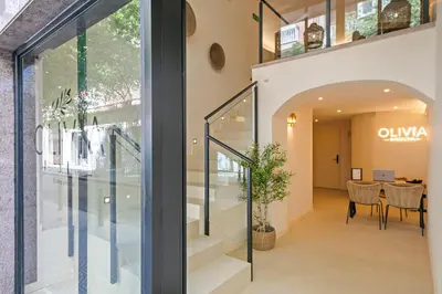 an internal view of the entrance to a building with glass doors at Olivia Barcelona in Barcelona