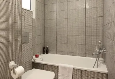 a bathroom with a tub and a toilet and a sink at Click&Flat Luxury Tetuan in Barcelona