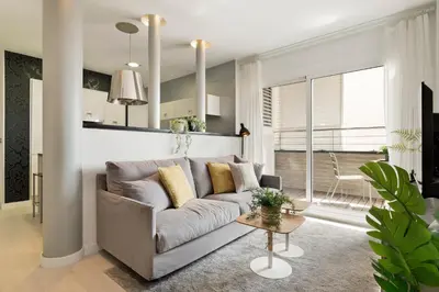 a living room with a couch and a table at Click&Flat Luxury Tetuan in Barcelona