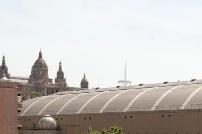 a building with a roof with domes in the background at Click&Flat Floridablanca in Barcelona