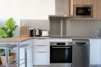 a kitchen with a stove and a counter top at Beach, Restaurants and Views in Castelldefels