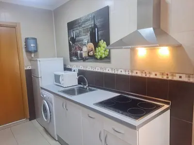 a kitchen with a sink and a stove top oven at Trip Barcelona Spain in Barcelona