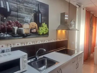a kitchen with a sink and a microwave at Trip Barcelona Spain in Barcelona