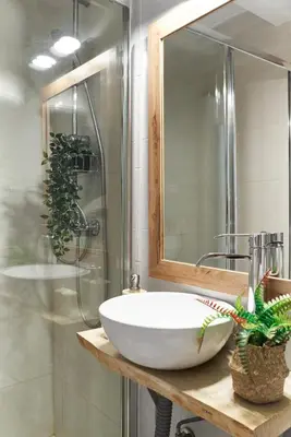 a bathroom with a white sink and a shower at HA Diputació terrace apartment in Barcelona