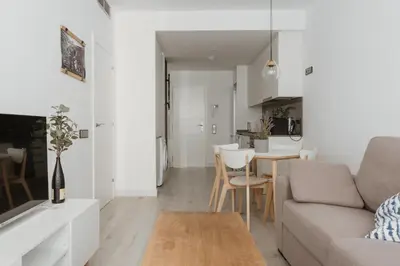 a living room with a couch and a table at Apartamentos Espai Progres by Be Barcelona in Hospitalet de Llobregat