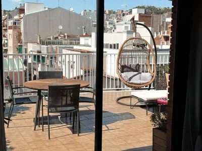 a view of a balcony with a table and chairs at Casa Cosi - Industria in Barcelona