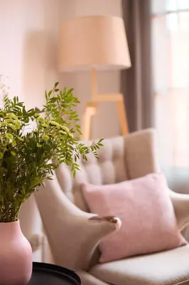 a living room with a white couch and a lamp at Casa Cosi - El Farro 3 in Barcelona