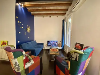 a living room with two chairs and a couch at Sant antoni apartment in Barcelona