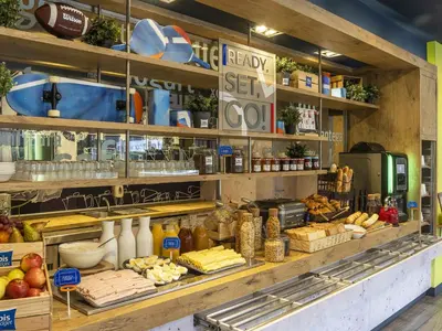 a basket of pastries and a bowl of bread at Ibis Budget Barcelona Sant Andreu De La Barca in Sant Andreu de la Barca