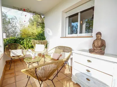 a room with chairs and a table and a window at Villa Elysian by Hello Homes Sitges in Sant Pere de Ribes