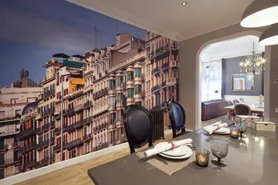 a dining room with a wall mural of buildings at Apartments Barcelona & Home Deco Centro in Barcelona