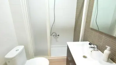 a bathroom with a shower and a toilet and a sink at Homenfun Barcelona Paralelo in Barcelona
