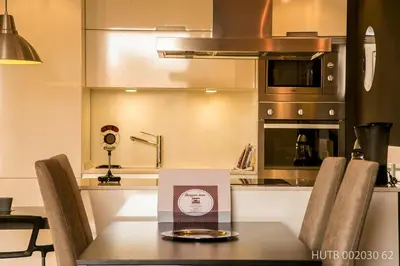 a kitchen with a table with a box on it at Alcam Molino in Barcelona