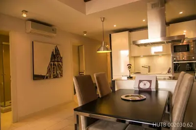 a kitchen and dining room with a table and chairs at Alcam Molino in Barcelona