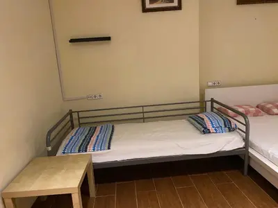 a room with two bunk beds and a table at Hostal Granvia 628 in Barcelona