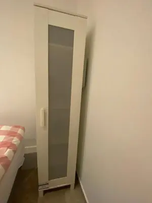 a glass door in a room with a bed at Hostal Granvia 628 in Barcelona
