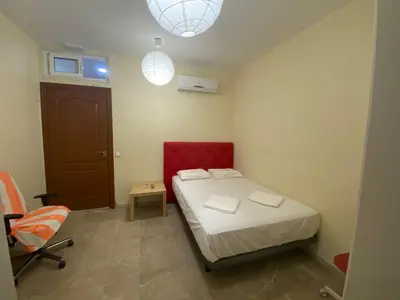 a small bedroom with a bed and a chair at Hostal Granvia 628 in Barcelona