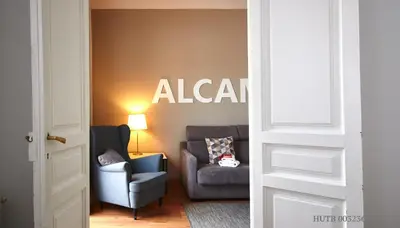 a living room with a couch and a chair at Alcam Rizal in Barcelona