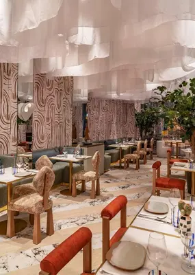 a restaurant with tables and chairs in a room at Vincci Gala in Barcelona