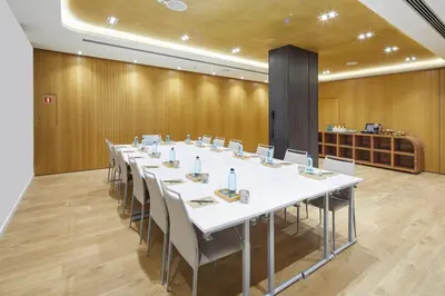 a large conference room with a long table and chairs at Vincci Gala in Barcelona