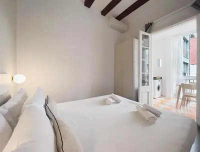 a bedroom with a large white bed in a room at Stay U-nique Apartments Vila de Gracia in Barcelona