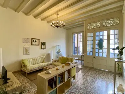 a living room with a couch and a table at El masnou in Masnou